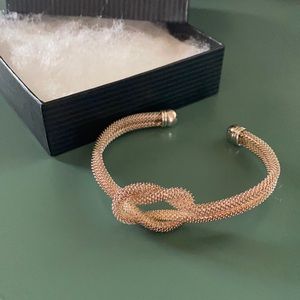 Gold Tone Love Knot Cuff Bracelet
